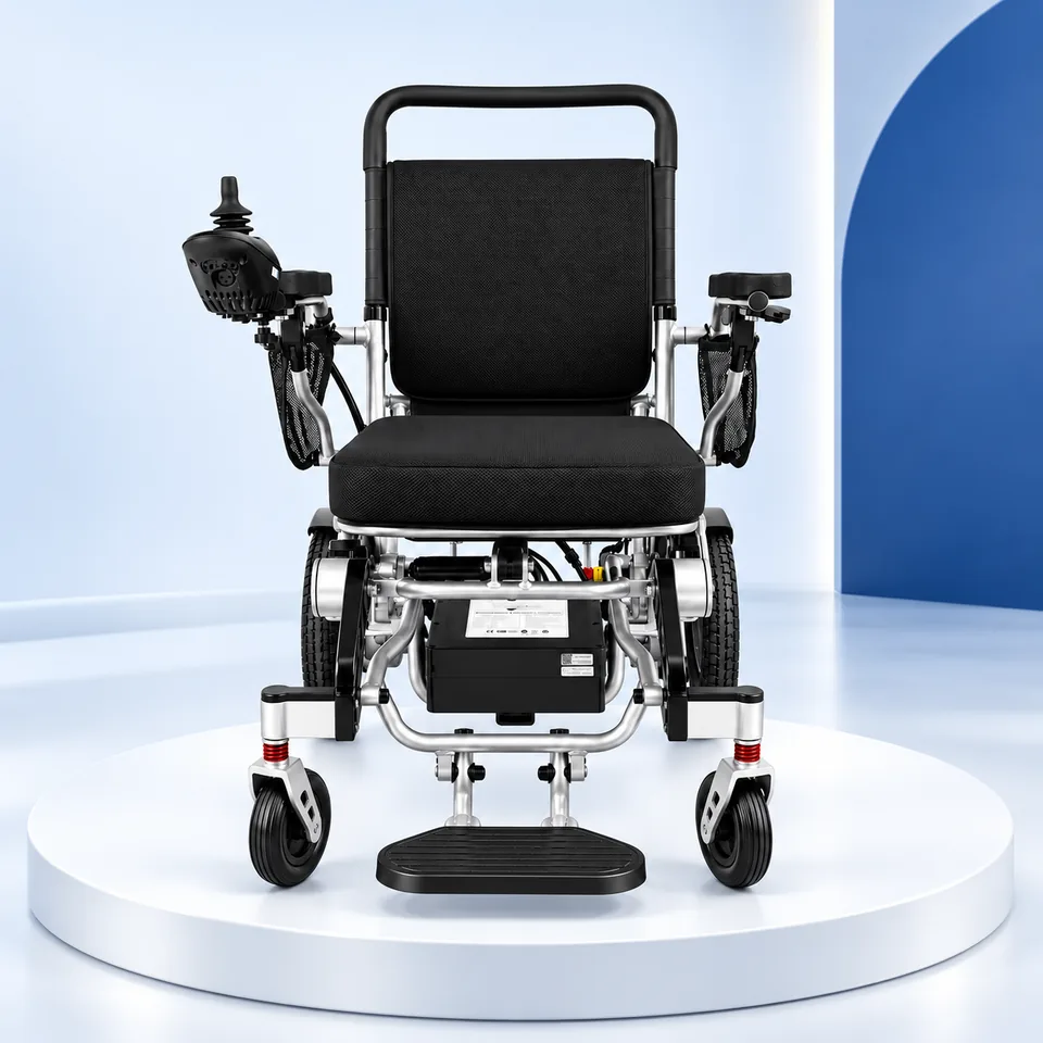 Black electric wheelchair on a studio display